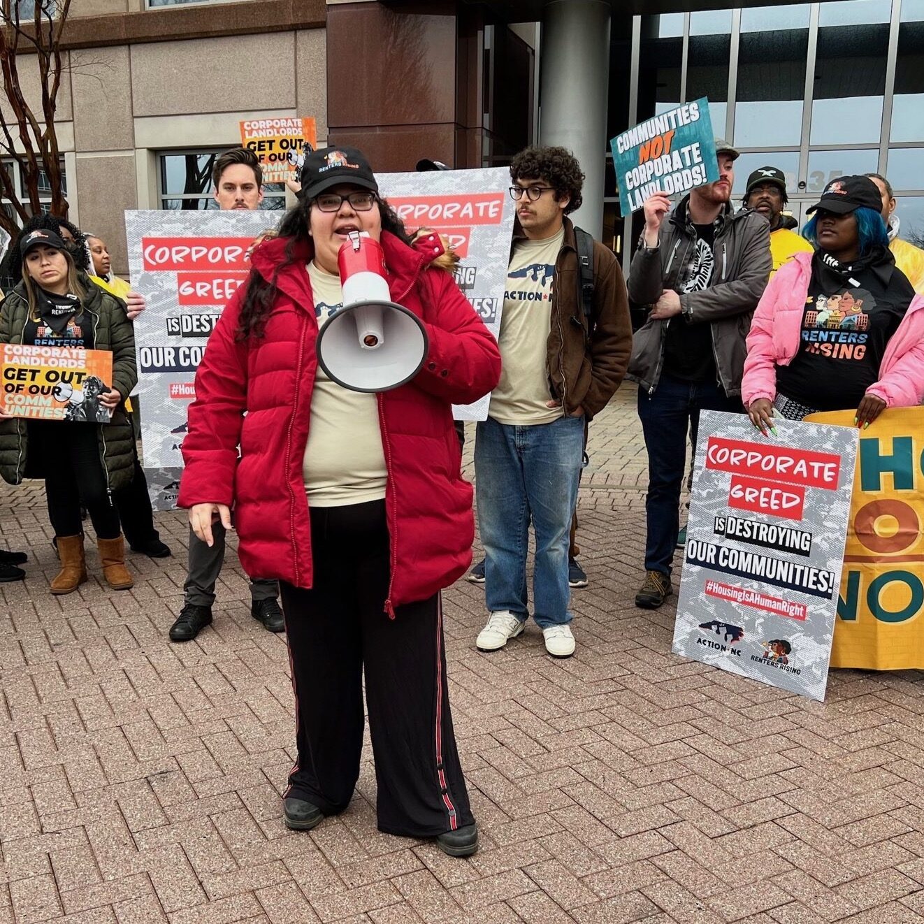 Tenant organizing resource center members at a protest outside a corporate landlord office